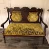 Elegant camelback sofa covered in rich federal gold damask. 1