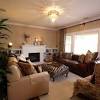 Place beige and cream cushions on the sofa to integrate it with the walls. 1