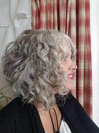 Let Your Natural Silver Lights Shine Grey Curly Hair Curly Hair Styles Bangs With Medium Hair
