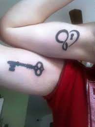 Black Color Lock And Key Heart Matching Tattoos On Biceps The key that comes along is a very pretty one that typically features a skull or a diamond that is studded on the top of it. black color lock and key heart matching