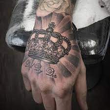 15 Stylish And Best King Tattoo Designs With Pictures In 2021 Crown Hand Tattoo Hand Tattoos For Guys King Tattoos