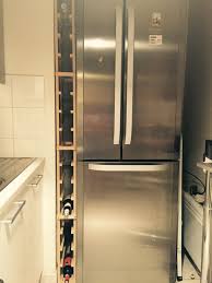 Une Petite Etagere Verticale Fait Maison Pour Ranger Les Bouteilles Tres Pratique Range Bouteille Vertical Range Bouteille Etagere Verticale