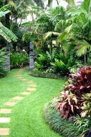 Tropical fruits are fairly easy to grow as they don't require much care or maintenance! 50 Creative Garden Designs You Can Create To Add Beauty To Your Landscape Tropical Ga Tropical Garden Design Tropical Landscaping Backyard Garden Landscape