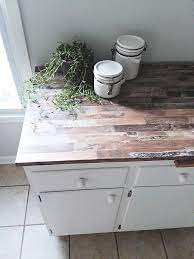 Measure and cut the faux wood peel and stick wallpaper to fit the countertop. Make A Faux Wood Countertop With Peel And Stick Wallpaper Stow Tellu