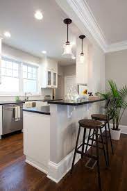 Open kitchen design with half wall. Kitchen From Property Brothers Episode Heather Franklin Features Savoy House Glass Filament Kitchen Bar Design Kitchen Remodel Small Kitchen Remodel Layout