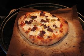 No Knead Pizza Baked On A Lodge Cast Iron Pizza Pan Cast Iron Pizza Pan Knead Pizza Pizza Bake