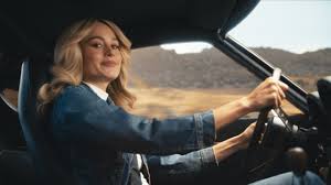 While driving their nissan rogue through the neighborhood, a woman asks her family what they want to do that day. Who Is Gorgeous Blonde Shifting Gears In Nissan Car Commercials