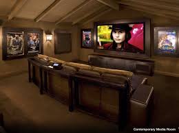 Sofas can be brown but they can be brightened up with amber pillows. 20 Great Looking Theater Room Ideas Home Theater Design Home Theater Rooms Media Room Design