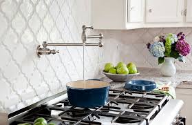 The clean white tile and grey grout lines are perfect for a modern home. Full Of Life How To Add Moroccan Style Tiles To Your Home