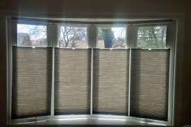 Are you having trouble determining the best window covering solution for your bow or bay window? Budget Blinds Custom Window Coverings Shutters Shades Drapes Bow Window Treatments Window Treatments Living Room Bow Window