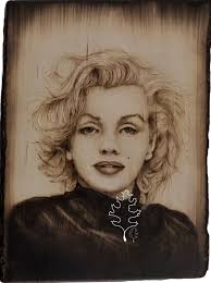 Woodburning art pieces win second place at Tattoo expo