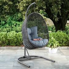 W hanging pumpkin patio swing hammock chair with base in sand dreamcatcher this stylish hanging chair adds an eye catching this stylish hanging chair adds an eye catching design and comfortable place to stop and enjoy all your beautiful garden labors providing a comfortable place to relax indoors or on your patio, this chair is a great conversation piece. Patio Wicker Hanging Chair With Stand And Blue Cushion Decoraciones De Casa Decoracion De Unas Casas