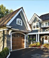 Black And White House With Wood Garage Door Pin By A Substantial Life On Home Colors Exterior House Colors House Paint Exterior Exterior Paint Colors For House