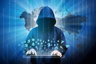 Computer hacker silhouette of hooded man | OU News | Open University