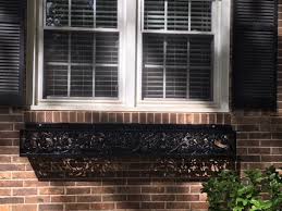 Building inspector says that i need to anchor the posts to the concrete. Repurposed Wrought Iron Supports