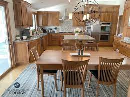 Dark shades of this sophisticated kitchen wall color work wonderfully at night. Should I Paint My Wood Cabinets Or Keep Them Stained Questionnaire Kylie M Interiors