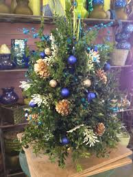 A Fresh Boxwood Tree Decorated In Blue Teal And Gold Visit Us At Lefrancoisfloral Com Norwichct Boxwo Christmas Decorations Boxwood Tree Tree Decorations