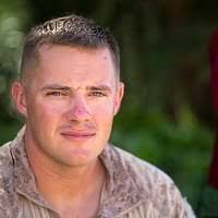 Airman 1st Class Kameron Freeman soothes her face with