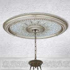 Smooth white finish ceiling medallion offers a versatile, easily installed backdrop for any ceiling fan or lighting fixture. Champagne Large Oval Ceiling Medallion Afd Home