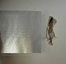 Enlarge the hole so this patch will fit by placing the piece over the hole, tracing its outline, and cutting the wall along your marks with a. How To Repair A Large Hole In Sheetrock Or Drywall Between Naps On The Porch