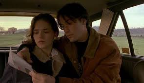 Mike enters the frame in front of a blue sky filled with white clouds. Picture Of My Own Private Idaho