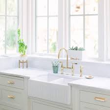 These are larger than single basin ones but are more expensive. Luxury 33 Inch Fireclay Reversible Farmhouse Double Basin Apron Front Kitchen Sink Alwen White Ceramic Sink With Stainless Steel Grid And Strainer Buy Online In Belize At Belize Desertcart Com Productid 176662539