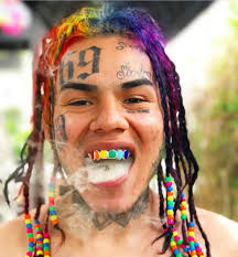 He has a knife tattoo on his forehead. Rappers With The Worst Face Tattoos Kanye To The