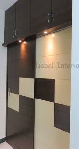 Sliding Shutter Wardrobe Loft Storage Spot Lights Above Shutters Cream Brown Vene Sliding Wardrobe Designs Bedroom Cupboard Designs Ceiling Design Bedroom