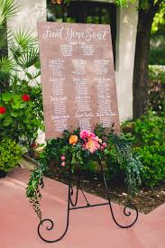 Wedding Seating Chart With Brightly Colored Peony And Garden