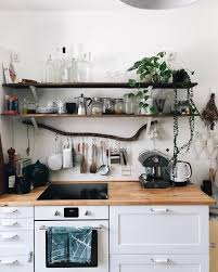 Farmhouse theme flower vase and towel rack 35 Boho Kitchen Decor Ideas For House Or Apartment In 2021 Boho Kitchen Boho Kitchen Decor Kitchen Decor