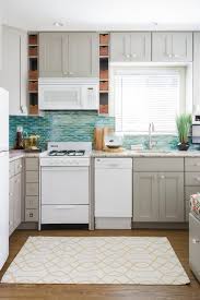 Shop in stock kitchen cabinets at lowe s. Lowes Diamond Brand Cabinets In Cloud Gray And Colorful Beach Decor Beach Style Kitchen San Diego By Danielle Interior Design Decor Houzz