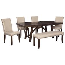 Trestle tables were very popular in the middle ages and they're still popular even today, being mainly appreciated for the fact that they're easy to assemble and to take apart, easy to transport and to store. Ashley Signature Design Rokane D397 35 4x02 00 Dining Table Set For Six With Bench Dunk Bright Furniture Table Chair Set With Bench