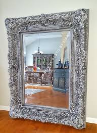 I have a super easy tip to share with you on how to paint a mirror frame without taping off! How To Paint An Ornate Mirror To Get An Updated Look Diy Ornate Mirror Mirror Frame Diy Pottery Barn Mirror