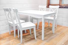 Argos home lido glass extending dining table & 4 chairs. Wooden White Dining Table And Four Chairs Stock Photo Picture And Royalty Free Image Image 38447673