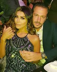 She is also a tv presenter. Amel Bouchoucha Et Walid Awada Masques Pour La Soiree Du Nouvel An Photos