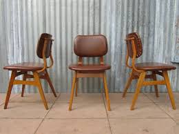 Shop wood dining room chairs and other wood seating from the world's best dealers at 1stdibs. Dutch Mid Century Vinyl Dining Chairs Set Of 3 For Sale At Pamono