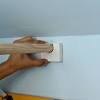 To really transform a closet, first paint the walls before installing the rod and shelf. 1