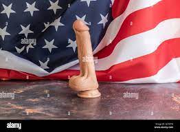 US flag background dildo on metal tabletop with orange and blue veins Stock  Photo - Alamy