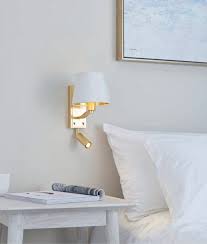Operated by a simple on/off switch and powered by a 60 length of cord, this lamp accommodates one a19 bulb (not included) to disperse bright light. Brushed Gold Bedside Wall Light With Pivoting Led Arm Shade In Gold