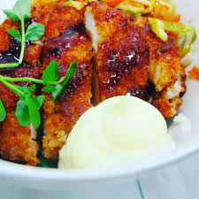 Topped with spicy mayonnaise, unagi sauce, and crunchy tempura bits. Chicken Katsu