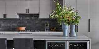 This is a new and innovative way of using a natural stone countertops as a backsplash. 25 Beautiful Kitchens With Dark Backsplashes Dark Kitchen Backsplashes