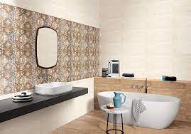 By keeping the walls and the vanity simple and neutral, the designer is able to experiment with the shower and floor tiles and create a load of visual interest with this starburst pattern. Bathroom Tile Designs