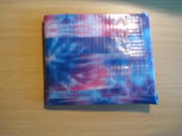 Take whatever color you used to make the strip along the side, and take the pieces and put them on the other side and bottom. Duct Tape Wallet A Duct Tape Wallet Construction On Cut Out Keep