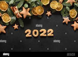 Date Christmas 2022 Christmas Holidays Glazed Cookies, Date 2022 , Orange Chips, Nobilis  Branches As Frame On A Black Background. Happy New Year. View From Above.  Flat La Stock Photo - Alamy