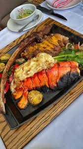 Foodbeast On Instagram Check Out This Massive Surf Turf Platter From Red O Known As La Tablita This Sizzling Pl Sizzling Platter Surf And Turf Platters