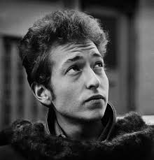 When all of your advisers heave their plastic At your feet to convince you  of your pain.....”. What's the plastic referred to here? Modern usage makes  me think of credit/bank cards, but