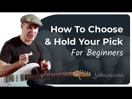 When you learn how to hold a guitar pick, make sure that a decent amount of pick can be seen. How To Hold A Guitar Pick Justinguitar Com