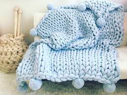 Anyone in love with blanket must have heard of homemoda. Chunky Knit Blanket With Pom Poms Arm Knit Throw Hand Knit Etsy Chunky Knit Blanket Arm Knitting Blanket Handmade Blanket
