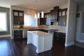 Simple Open Layout L Shaped Kitchen With Beautiful Flooring Summit Doors And A Slide In Stove Kitchen Remodle Kitchen Remodel Home Kitchens