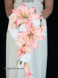 Get inspired by this architectural cascading bouquet with white calla lilies and crisp grass for a structured look. Pin By Laura Dimitrieva On Wedding Dreams Cascading Wedding Bouquets Wedding Bouquets Pink Peach Wedding Bouquet